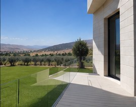 Villa terrace with glass balustrade