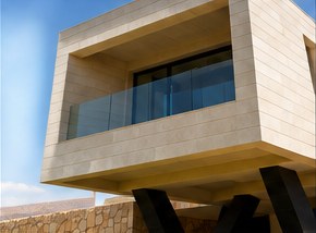 Cantilevered volume with glazed balcony